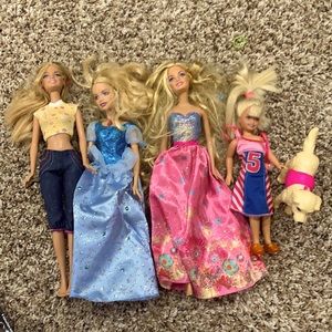 Set of 3 Barbies, one kid, and a dog